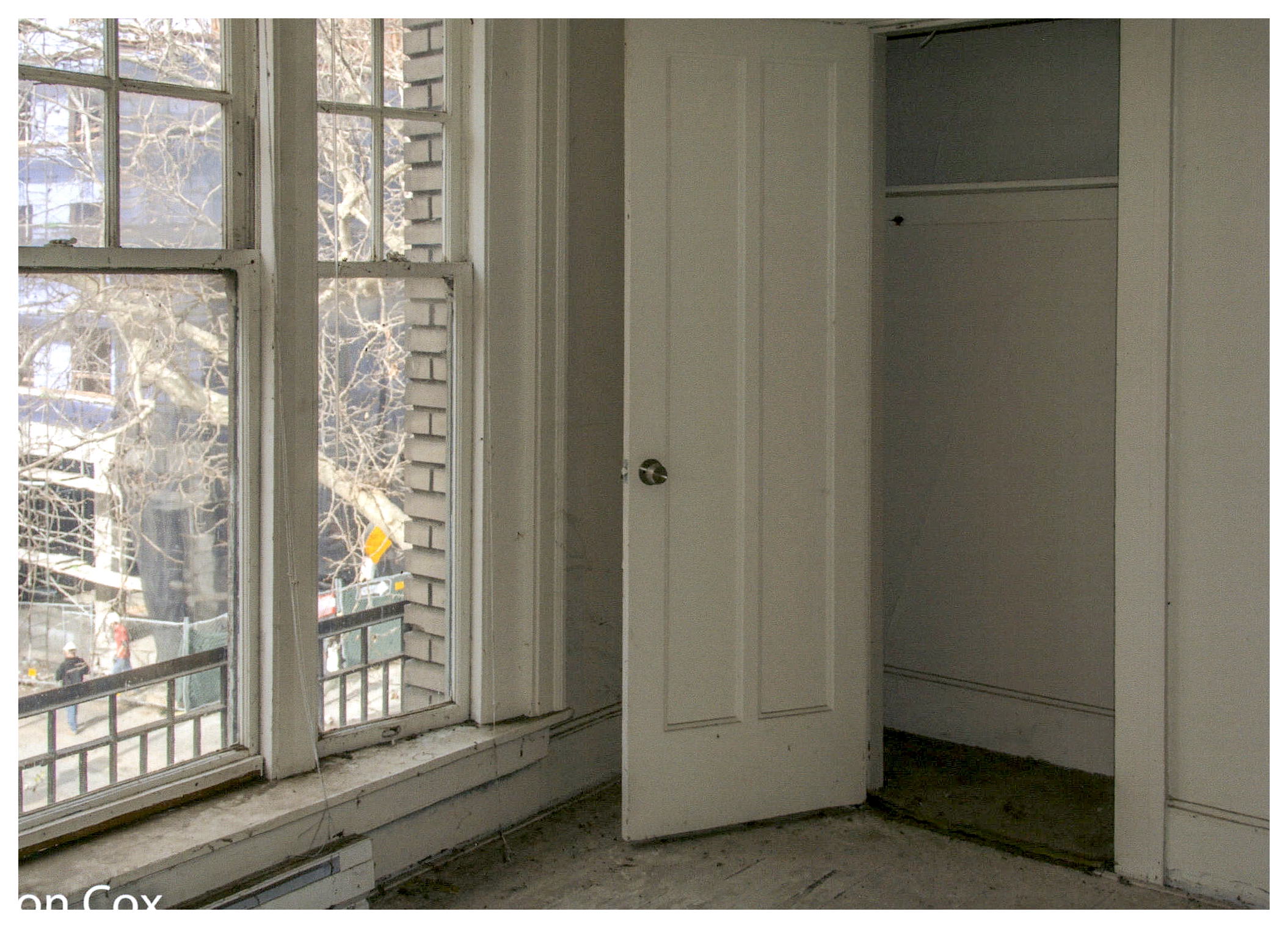 Before: interior view of bay window and adjacent closet prior to rehabilitation.